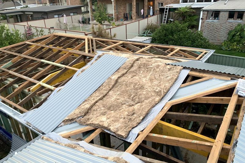 Roof trusses and sarking going on a brick granny flat
