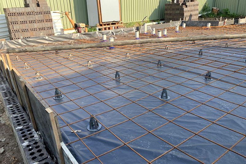 Reinforcing mesh and plumbing set out before the granny flat slab pour