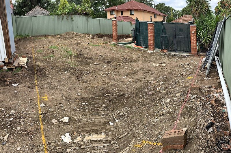 Cleared backyard site ready for a granny flat build in Sydney