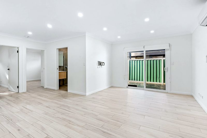 Corner of a refurbished room fitted with a kitchenette cabinet