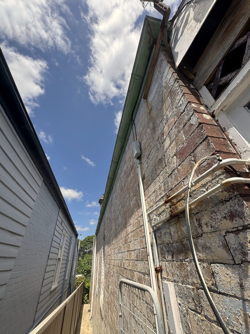 Gutter running down the side of a house in Sydney