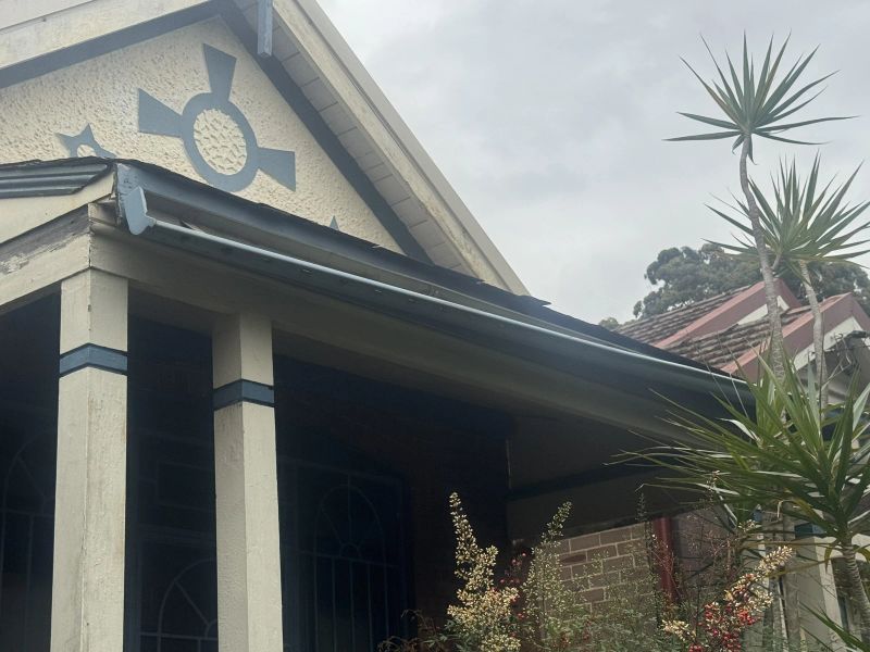 Close-up of a newly installed gutter and fascia line at the gable end of a Sydney home