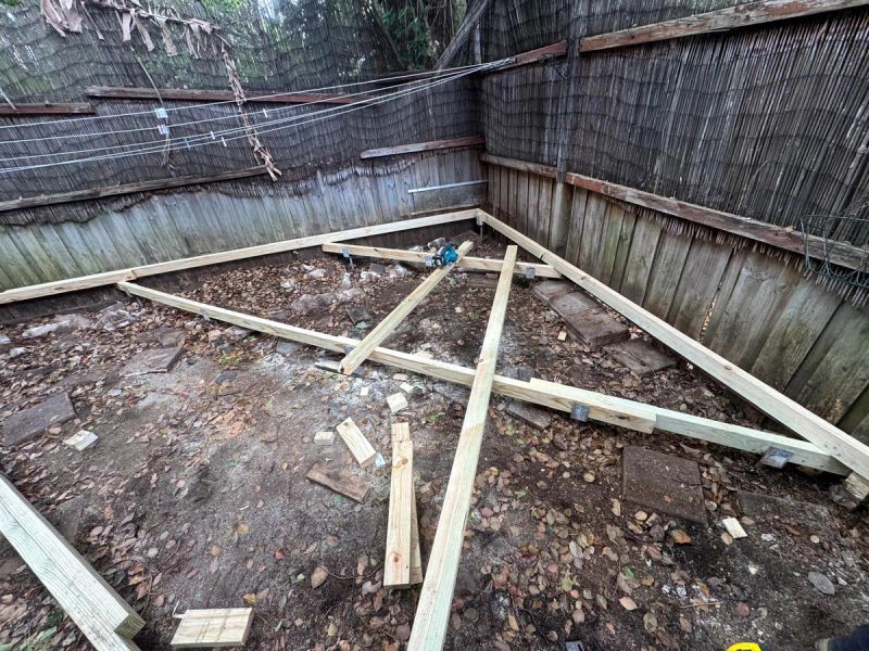 New treated pine bearers set out across the courtyard