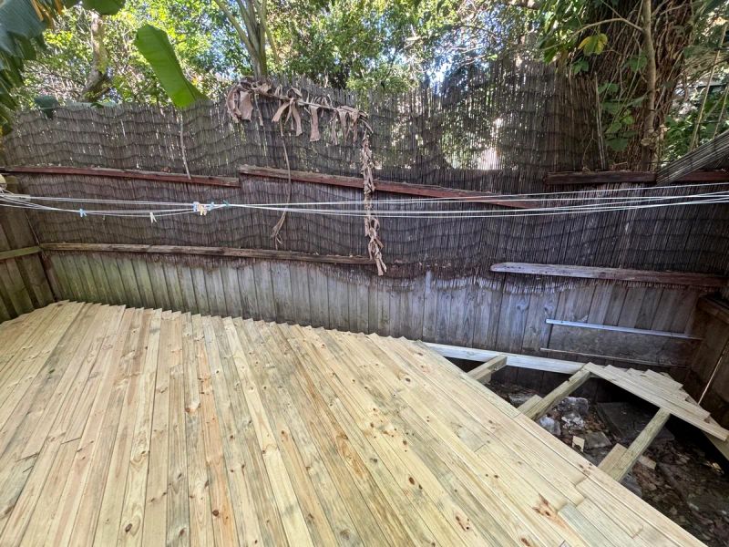 New treated pine deck boards laid to the back fence, edge trim still to go